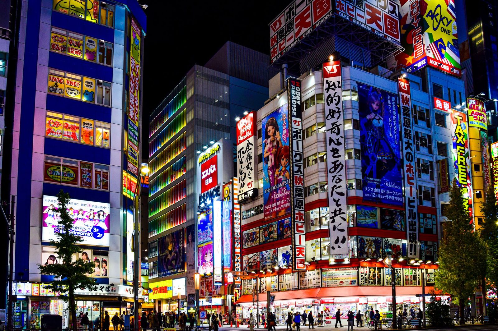 Anime-themed storefront with colorful characters and striped awning.