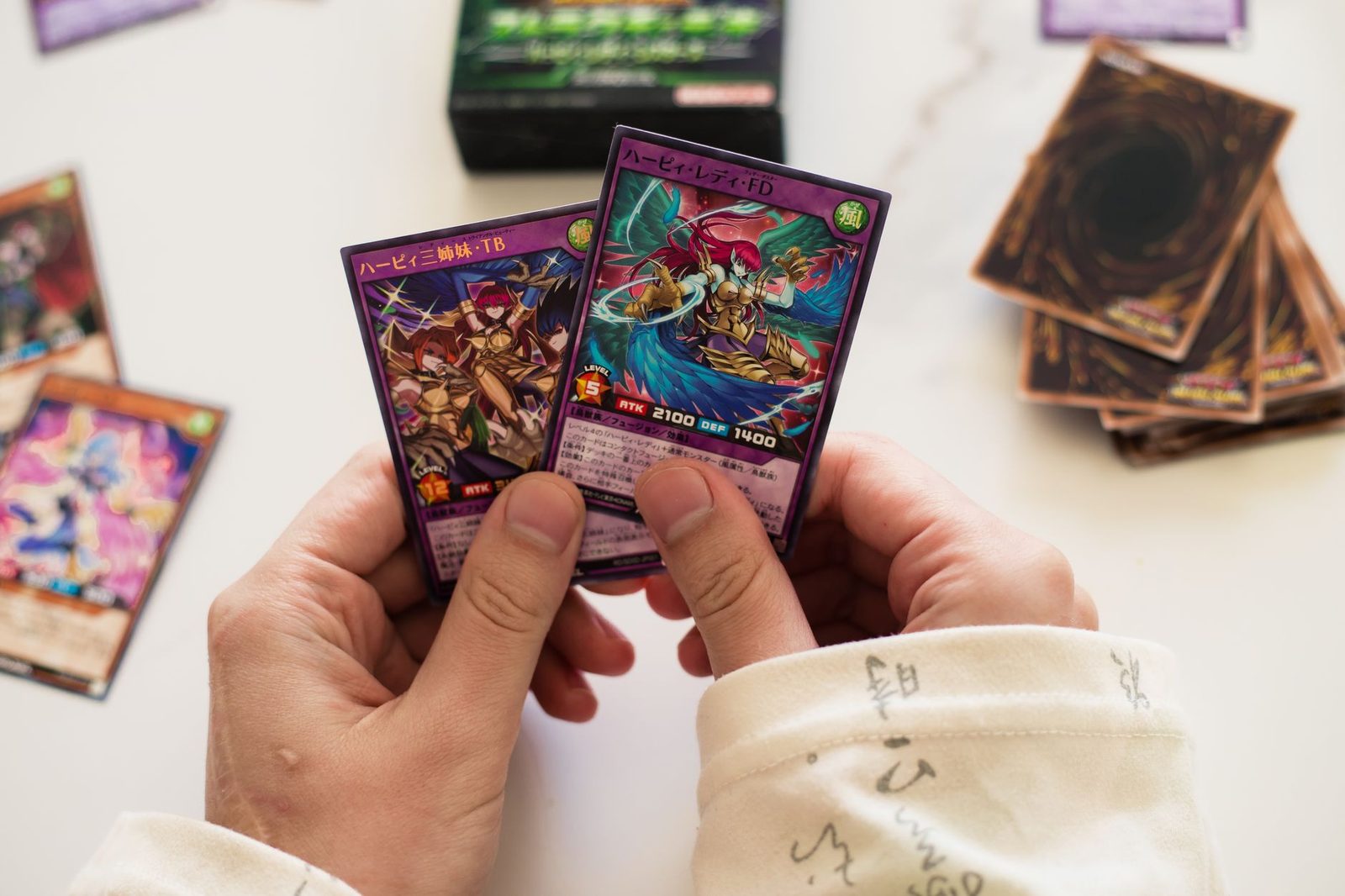A close-up view of Yu-Gi-Oh! trading cards in a display case showcasing rare and collectible cards.