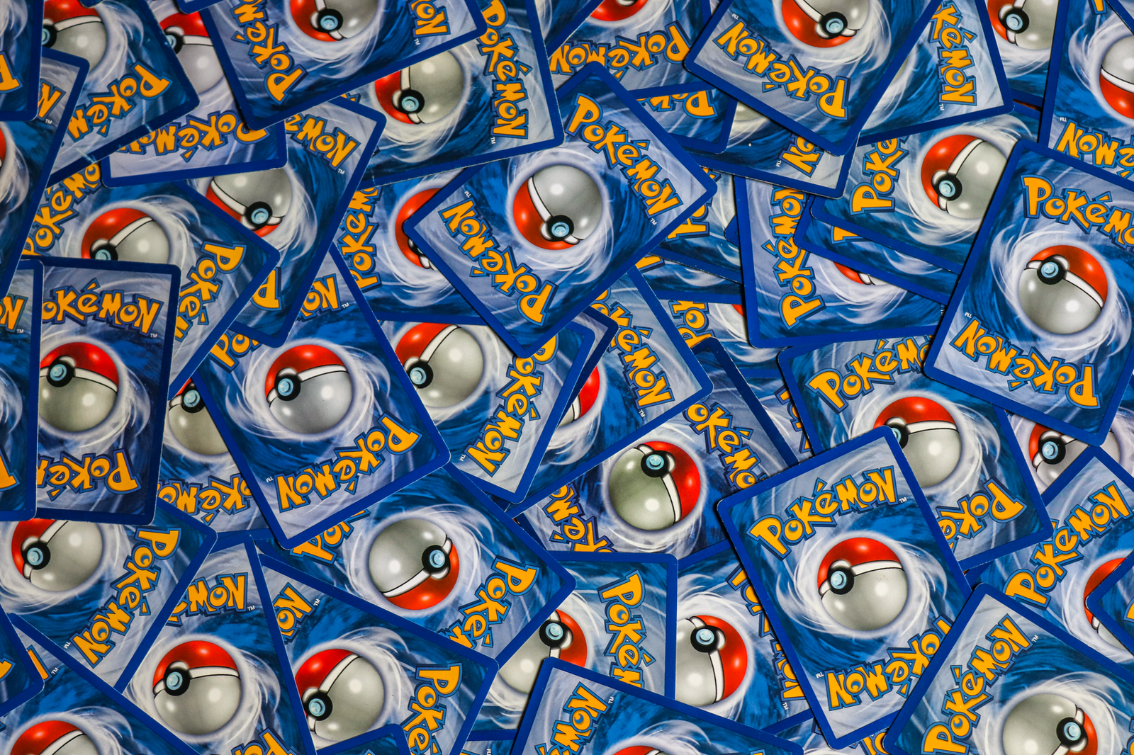 A close-up view of Yu-Gi-Oh! trading cards in a display case showcasing rare and collectible cards.
